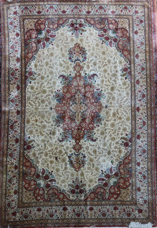 An Isphahan style silk carpet, 9ft 3in by 6ft 4in.